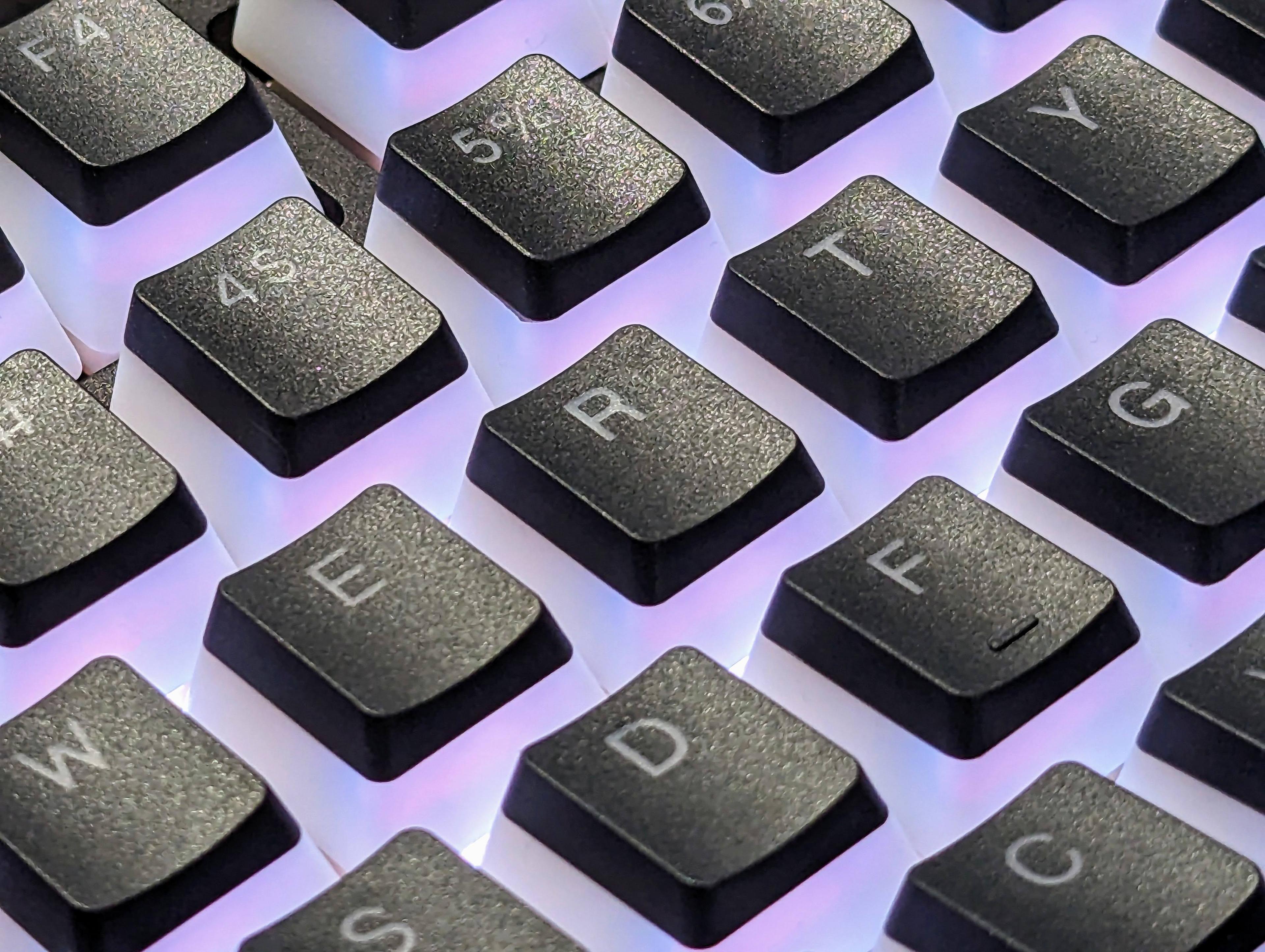 Close-up picture of a illuminated keyboard centered on the R key.