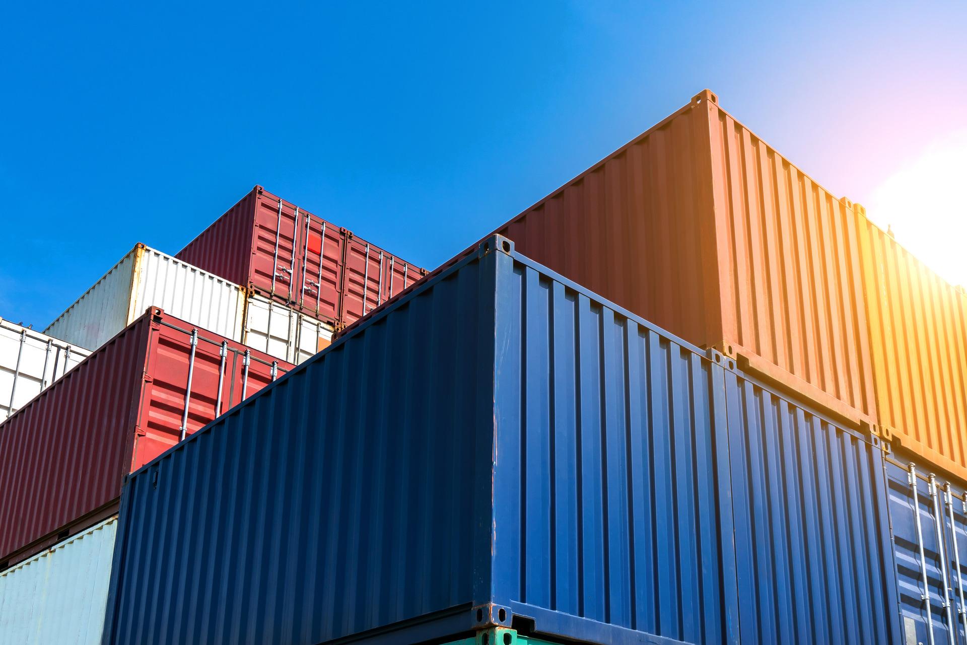 Photo of stacked shipping containers.